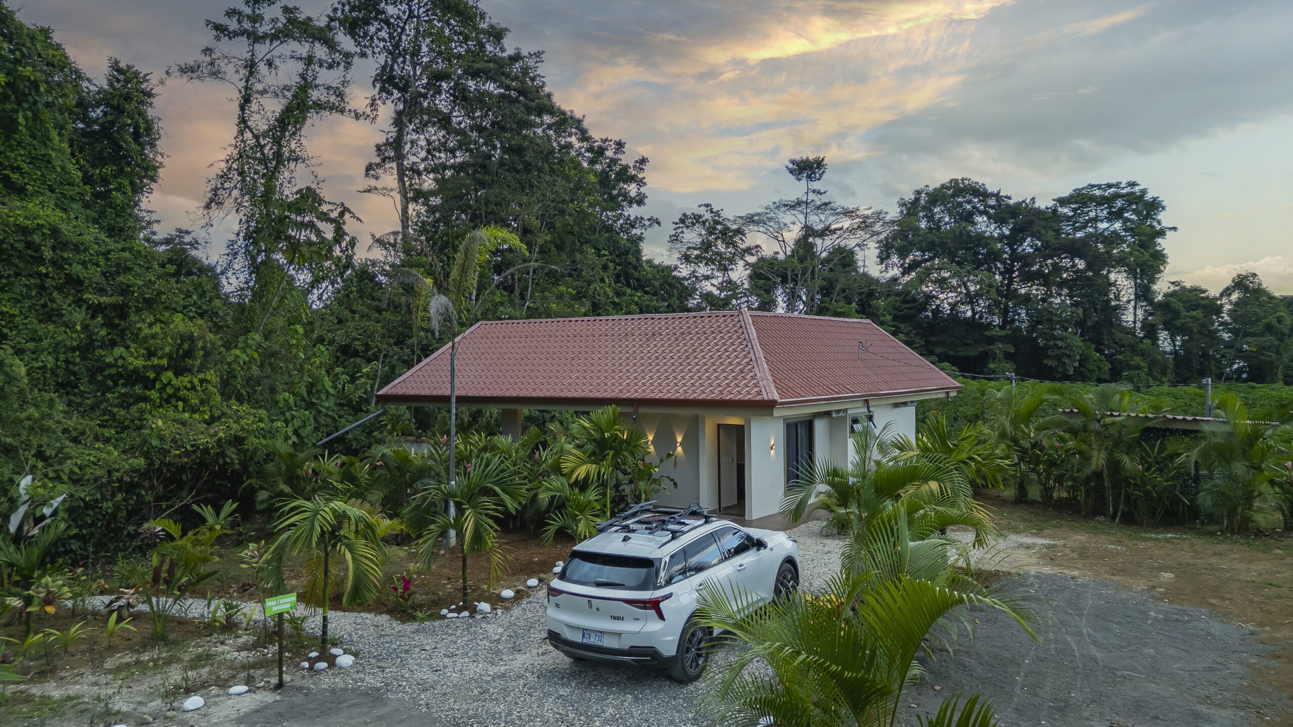 private villa entrance in la fortuna costa rica surrounded by tropical nature